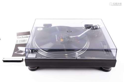 A Technics SL-1210 MK2 professional, direct-drive record tur...