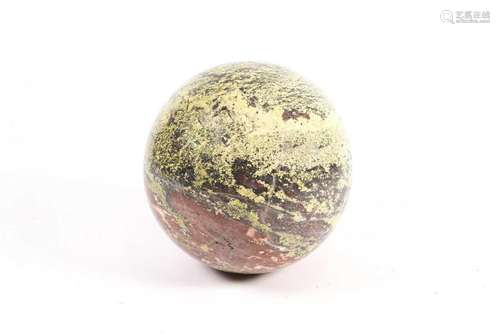 A green and red striated marble sphere, 27cm dia