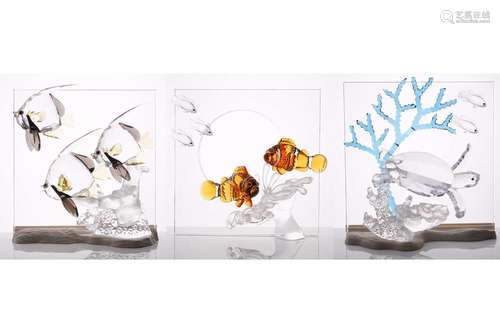 Three boxed Swarovski crystal commemorative items, from the ...