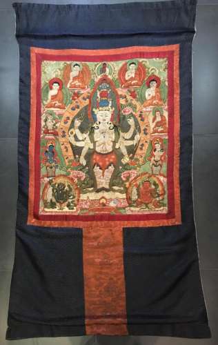 AN EMBROIDERED SILK THANGKA OF GUANYIN