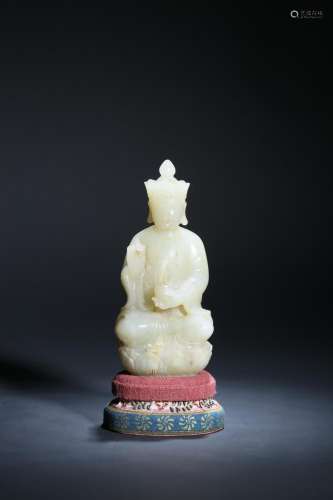 A CARVED WHITE JADE BUDDHA.QING PERIOD