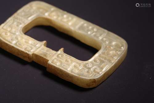 A CARVED JADE PENDANT.WRRRING STATES PERIOD