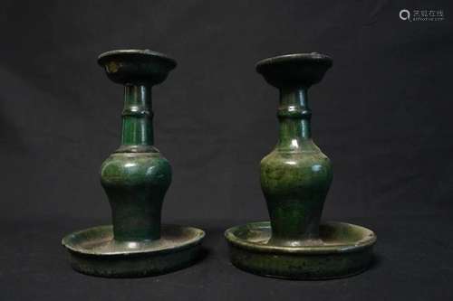 A PAIR OF PEACOCK GREEN CANDLESTICKS