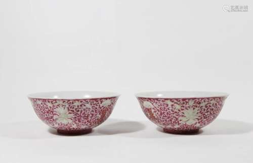 PAIR OF ROUGE RED GLAZED FLORAL MOTIF BOWLS