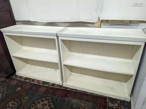 A pair of modern white painted dwarf open bookcases, length ...