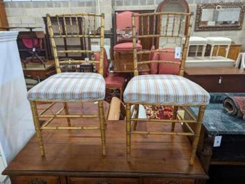 A pair of Regency simulated bamboo gilt wood side chairs wit...