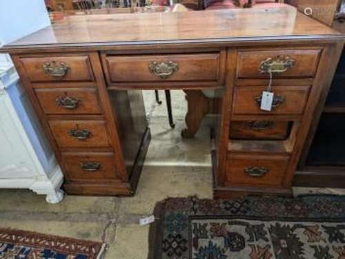 A late Victorian mahogany walnut kneehole desk, length 114cm...