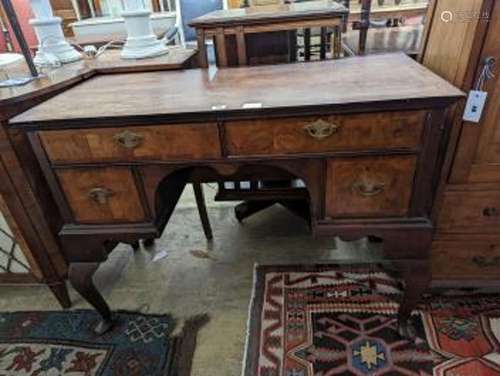 A Queen Anne revival banded walnut kneehole dressing table, ...