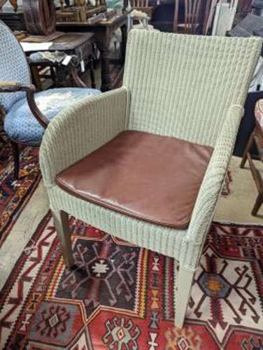 Vincent Sheppard, a set of four conservatory chairs with tan...