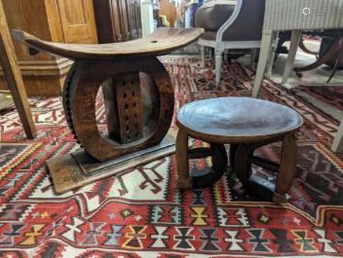 Two African carved hardwood stools, larger length 43cm, dept...