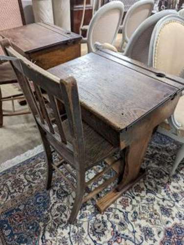 A vintage oak student's desk, width 57cm, depth 46cm, height...