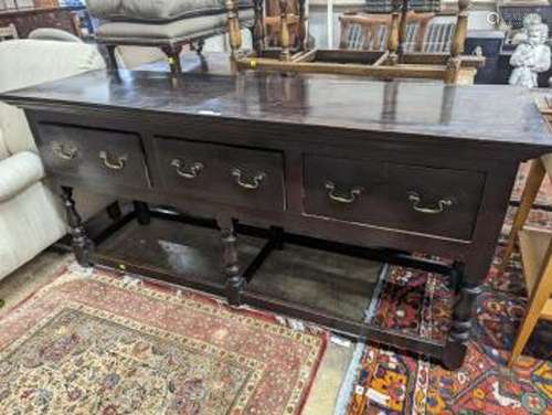 A George III oak low dresser base, length 175cm, depth 51cm,...