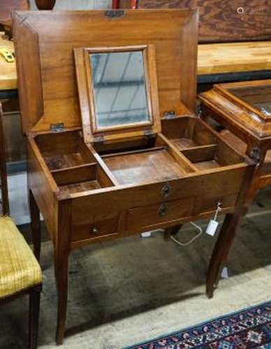 A 19th century French fruitwood enclosed dressing table with...