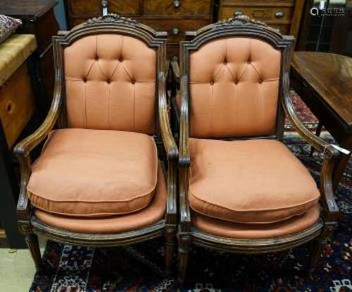 A set of four 19th century French carved walnut elbow chairs...