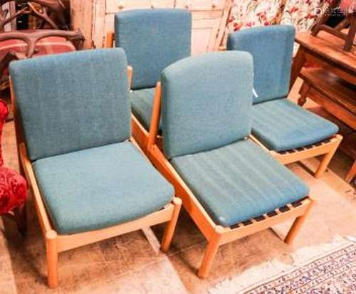 A set of four Ercol pale beech lounge chairs with cushion se...