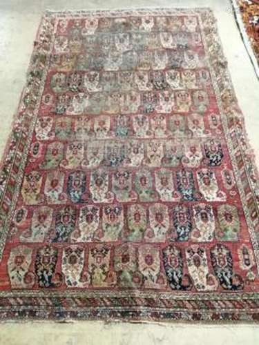 An antique Agra rug 210 x 124cm