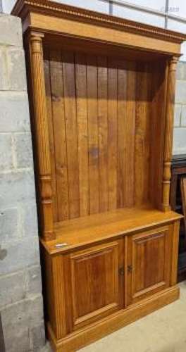 A Victorian style pale oak open bookcase, length 122cm, dept...