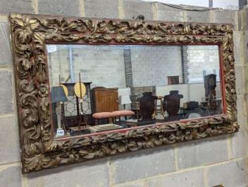 A 19th century carved giltwood rectangular wall mirror, widt...