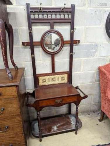 A late Victorian tile-backed mahogany wash stand, width 84cm...