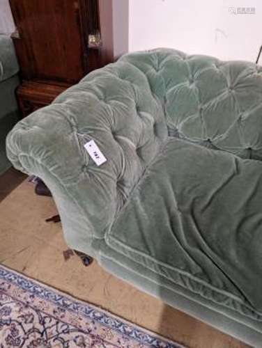 A late Victorian double drop arm Chesterfield settee upholst...