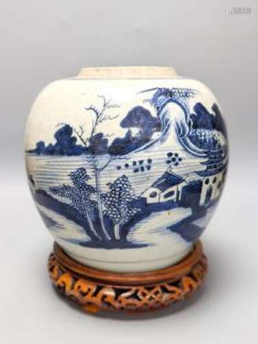 An 18th century Chinese provincial blue and white jar on a w...