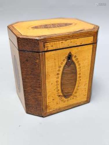 A George III octagonal sycamore and rosewood panelled tea ca...