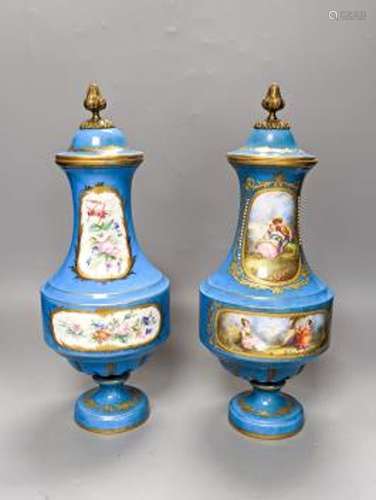 A pair of Sevres style porcelain bleu celeste ground vases a...