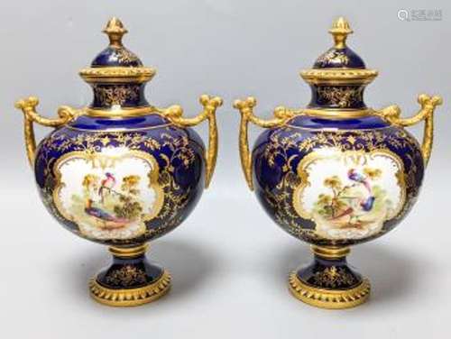 A pair of Coalport bird painted vases and covers, c.1900, in...