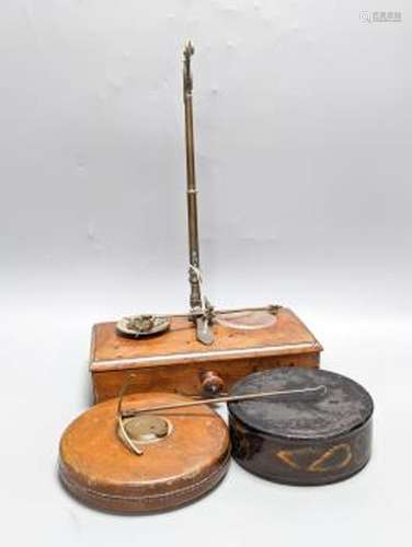 A Victorian cased weighing scale, two papier mache wine coas...