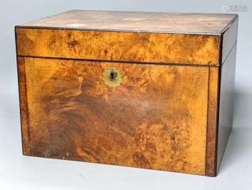 A Victorian walnut sewing casket, 34cm, containing sewing re...