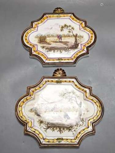 A pair of 19th century painted faience plaques in the style ...