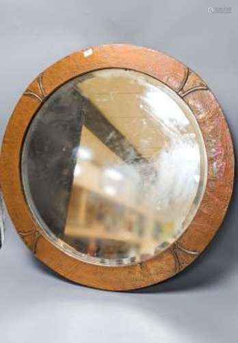 An Arts & Crafts circular copper mirror 56cm