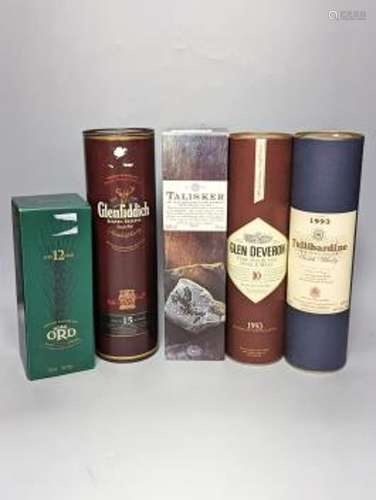 Five assorted bottles of single malt whisky including Talisk...