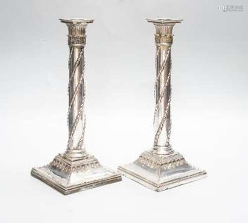 A pair of Victorian electroplate Corinthian column candlesti...