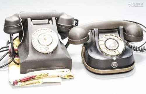 Two vintage telephones and 1950's colour-printed tablecloth