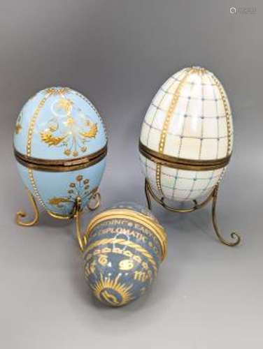 Two silver gilt mounted enamelled eggs with interior seascap...