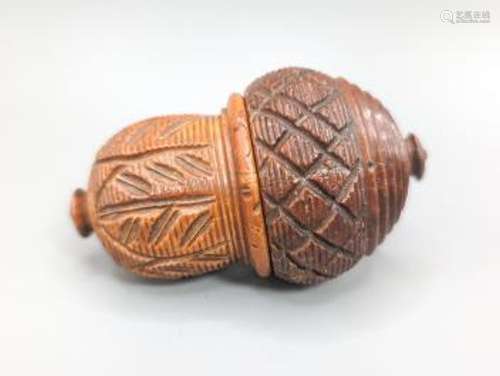 An early 19th century coquilla nut nutmeg grater, length 8cm