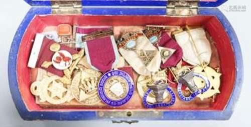 A group of Masonic medals some silver gilt, in a painted woo...