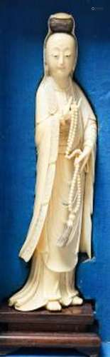 An early 20th century Chinese ivory figure of Guanyin holdin...