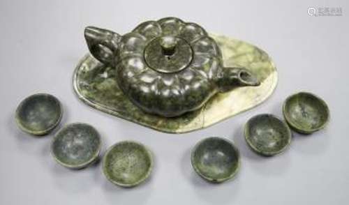 A spinach green jade melon shaped Chinese teapot and six cup...