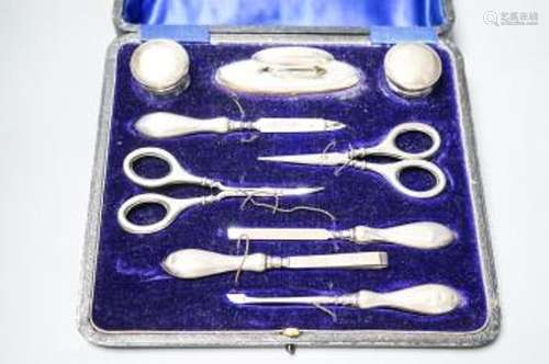 A cased silver mounted nine piece manicure set.