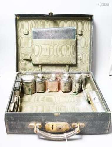 An Edwardian Harrod's traveling toilet case, fitted with six...