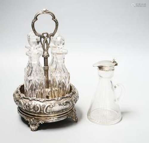 A late Victorian silver circular four division cruet stand, ...