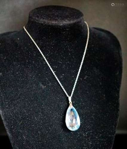 An 18ct mounted facetted pear cut aquamarine set pendant, 33...