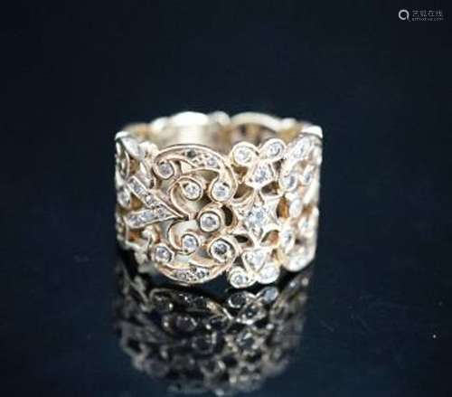 A continental pierced 14k and diamond chip set band, size L/...