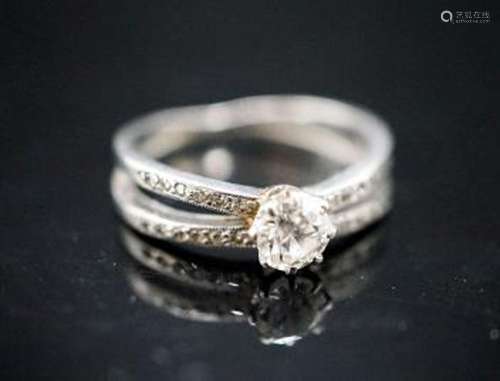 A yellow metal and single stone diamond ring, with diamond c...