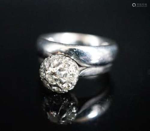 A modern 18ct white gold and diamond cluster ring, now solde...