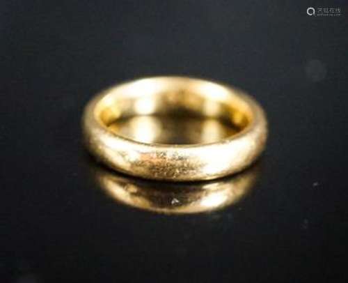 A 22ct. yellow gold wedding band, size L, 6.4 grams.