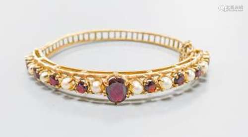 A 9ct gold, garnet and cultured pearl set hinged bracelet, g...