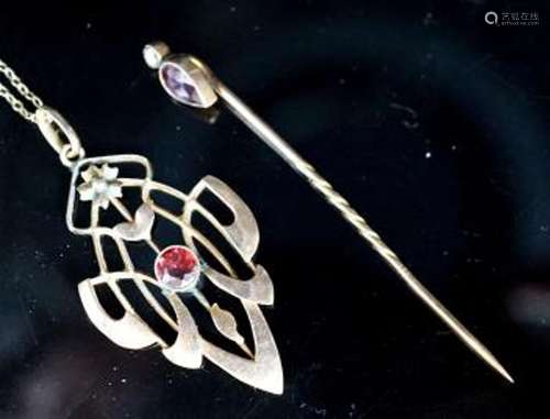 An Art Nouveau yellow metal and garnet set pendant,39mm, on ...